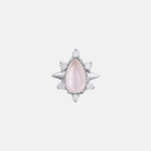 Pink teardrop-shaped gemstone with silver starburst setting on a light gray background