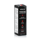 A black rectangular box of inferno Piercing Aftercare Isotonic Saline Solution, 60ml, shown on a white background with a soft reflection.